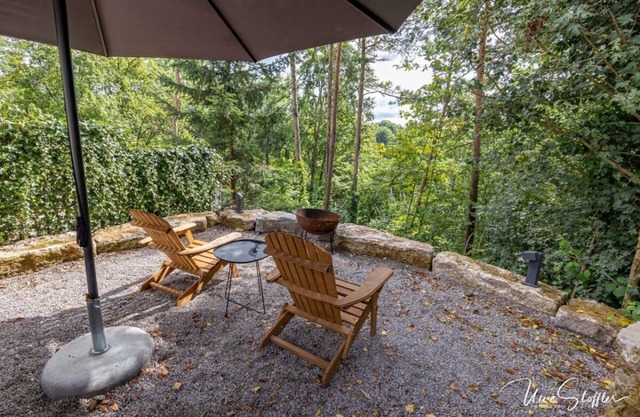 Vacation home Schrat with fireplace in an idyllic location on the edge of the forest below a wellness hotel.