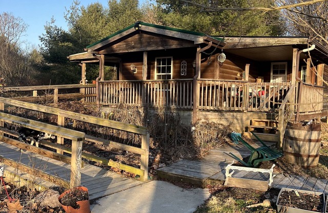 Very nice single wide home with addition, wrap around deck & pond on 6.96 acres.