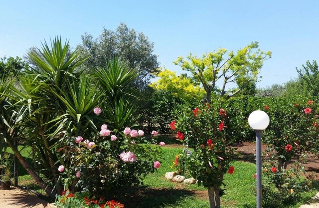 Villa Cristina with garden and lots of greenery.