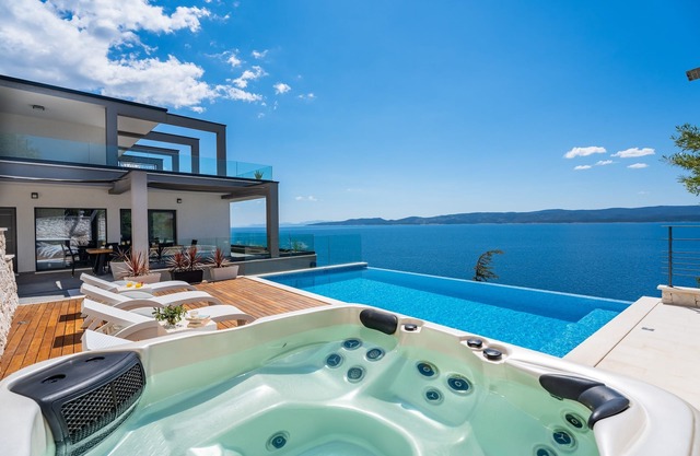 VILLA HRID Luxury beachfront villa, Jacuzzi, heated infinity pool with massage