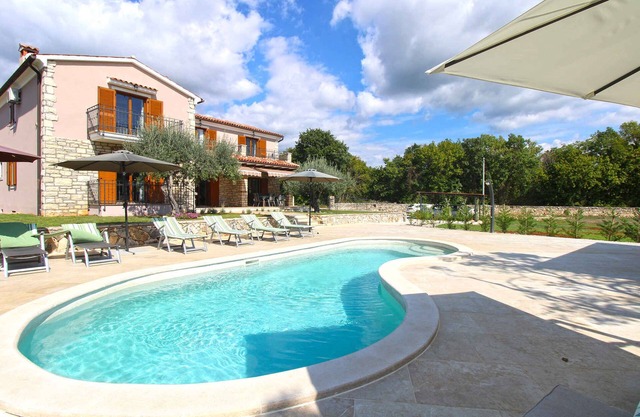 Villa with swimming pool, children's playground and fitness room
