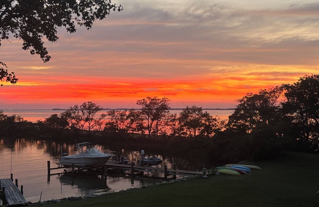 WATCH THE EVER-CHANGING SUNSET REFLECT OVER THE EASTERN BAY