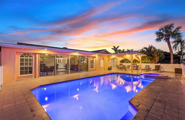 Water Front Home with Heated Pool & Hot Tub, 2 Master Suites & a Floating Dock