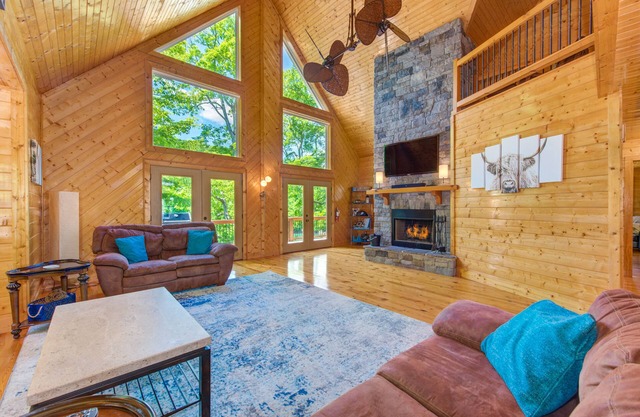 Waterfront home with game room, theater, deck, dock & fireplace