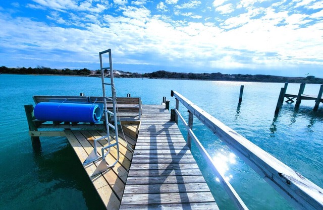 Waterfront Home with a private dock, hottub, and 3 miles to the beach