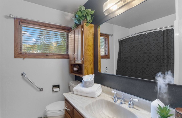 Welcoming 2-bedroom home with large deck and central location.