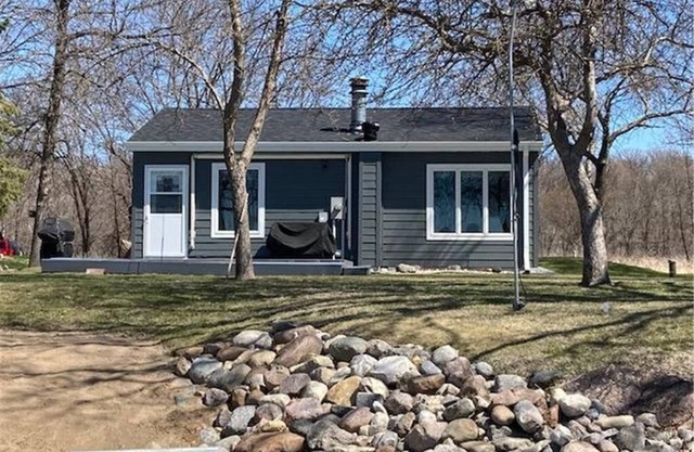 Year round cabin on level lot with dock