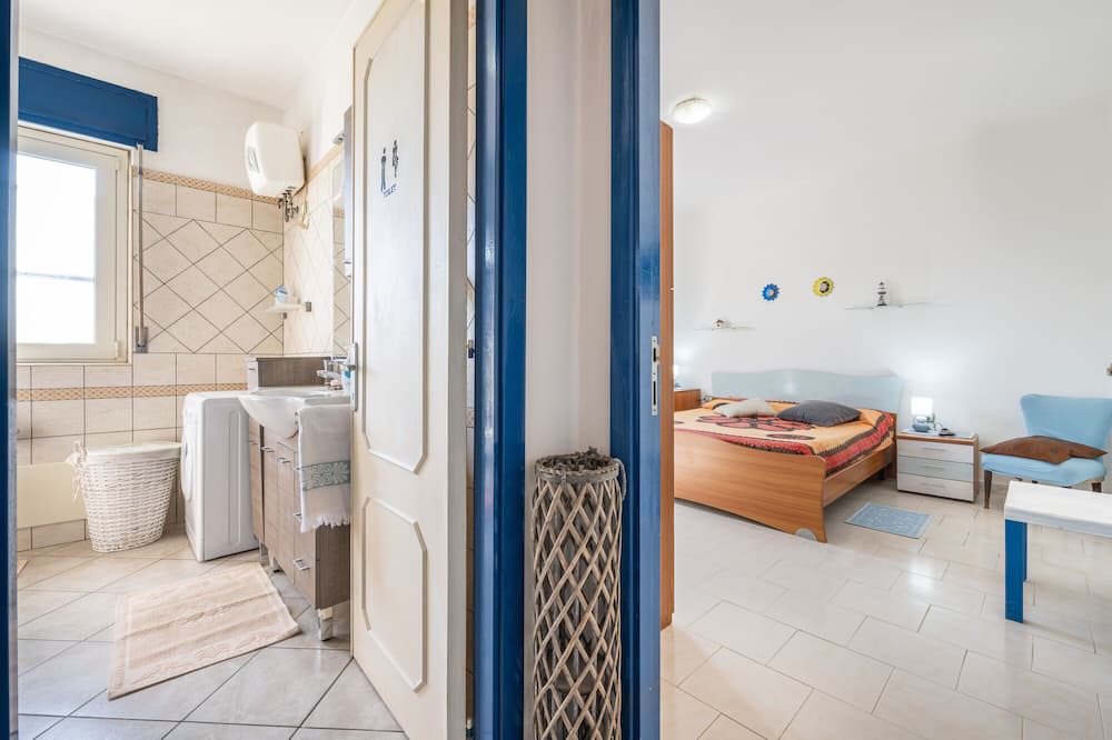 Giba House | Holiday Home 'La Casa Di Coccola' with Private Terrace, Wi-Fi and Air Conditioning