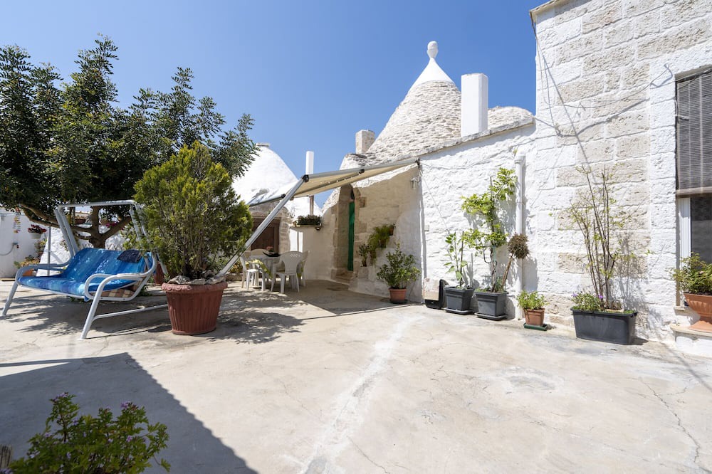 Casalini House | Holiday Home 'Trullo Antica Pietra' with Private Terrace, Private Garden and Air Conditioning