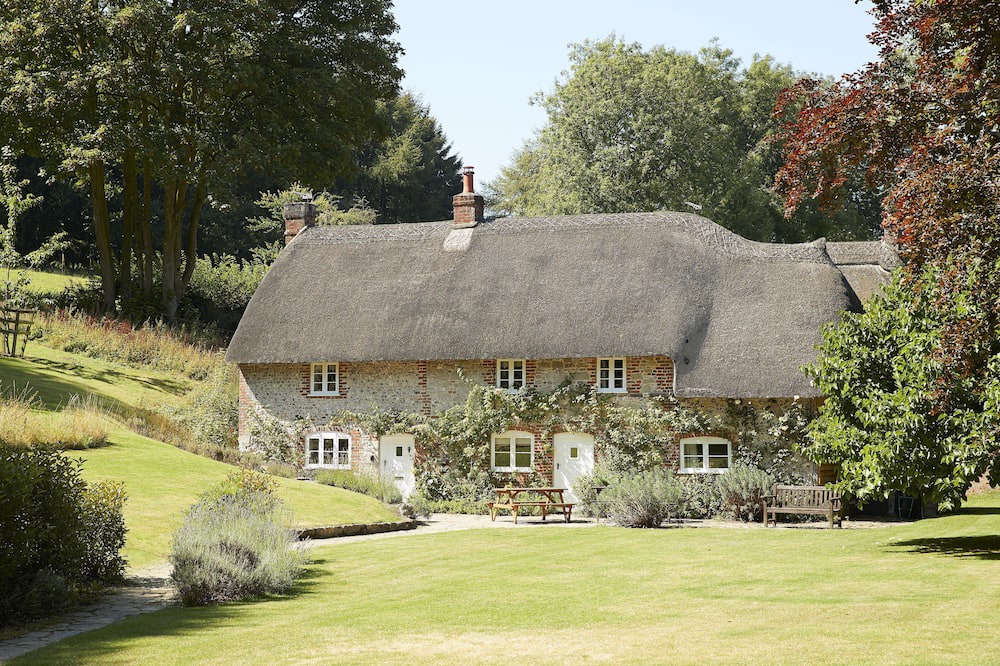 Ebbesborne Wake Cottage | This beautiful 300-year-old detached thatched cottage nestled within the stunning Cranborne Chase.