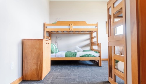 Private room with ocean view, 2-piece bathroom, shared showers - accessible