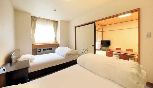 Japanese/Western-style: 10Tatami-mats + Twin Room + Separate Sitting Area (Non-smoking, with shower)