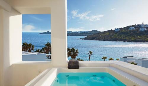 Deluxe Room with Outdoor Hot Tub and Partial Seaview