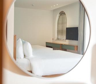 Deluxe Family Room with Balcony and City View