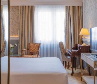 Deluxe Old Port View king bed, marble bathroom and wooden floor