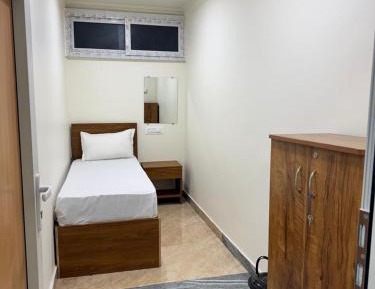 Single Bed in Dormitory Room