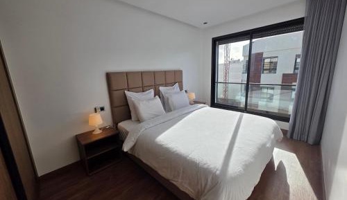 One-Bedroom Apartment with Balcony and City View