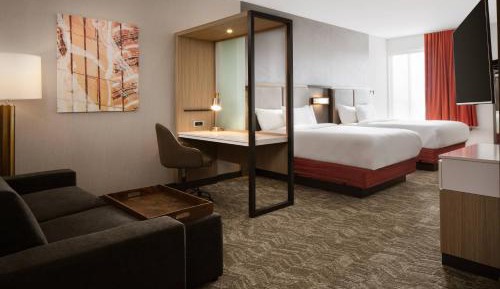 Suite with Two Queen Beds and a sofa