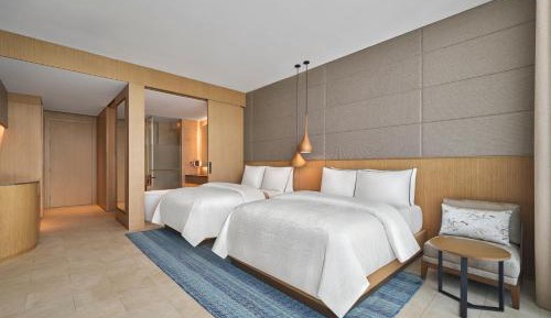 Deluxe Garden view with Two Double Beds and Balcony