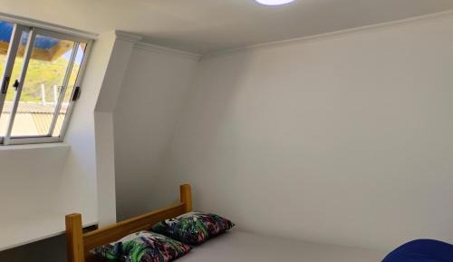 Single Bed in Dormitory Room