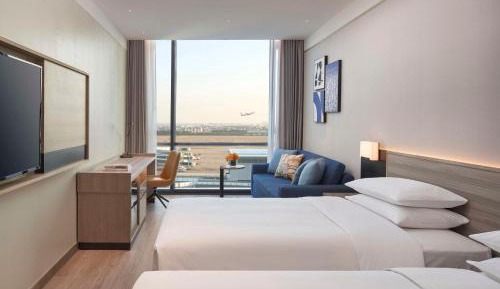 Twin Room with Sofa Bed and Airport View