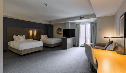 Studio Room with Two Double Beds and Sofa Bed