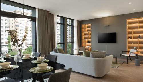 Three-Bedroom Apartment with Balcony and City View