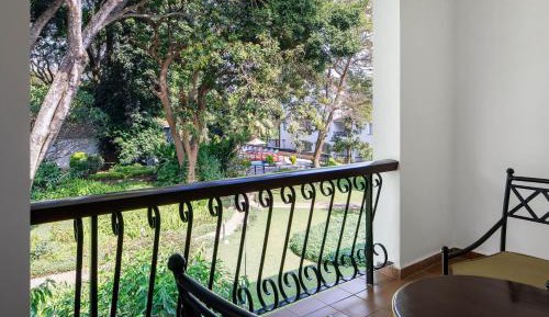 Premium Deluxe Queen Room with Two Queen Beds, Balcony and Garden View