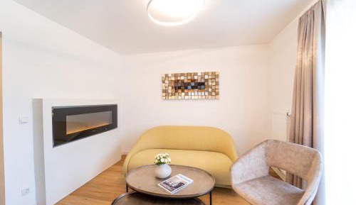 Suite with electric fireplace and balcony