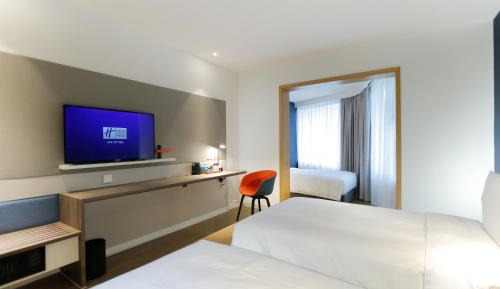 Standard Room with One Queen Bed and Twin Beds
