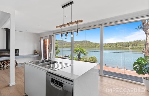 Central Coast Council House | Discover Your Riverside Retreat: Modern Comforts, Private Jetty, & Scenic Views!