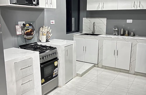 Oyster Bay Apartment | Stylish 2BR Masaki Retreat With POOL & GYM