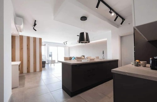 Paceville Apartment | A contemporary studio in the exclusive Offshore Suites, St. Julian’s. This bright, spacious flat offers elegant design, a fully equipped kitchen, and a sofa bed—perfect for up to four guests seeking comfort and style near the sea.