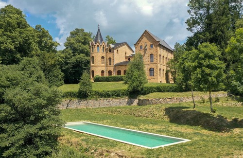 Sant Hilari Sacalm Villa | Elegant Modernist castle in Catalonia, Spain with pool, tower and chapel