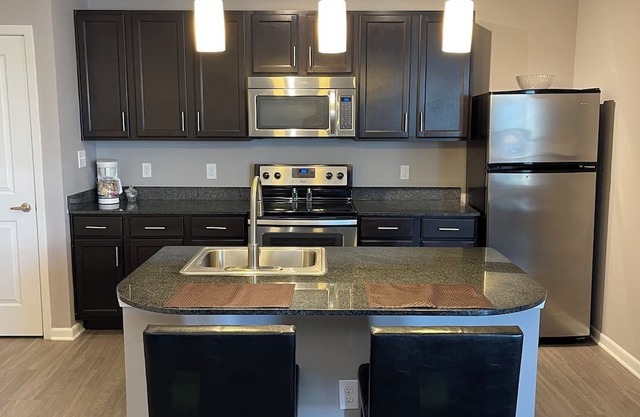 Right at Polaris! 3rd floor w/elevator access and garage parking included!