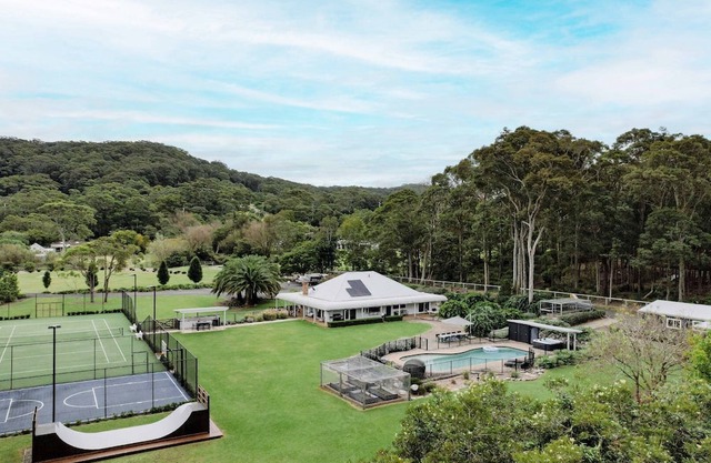 Secluded acerage with floodlit tennis and basketball courts, pool, firepit and beautiful homestead